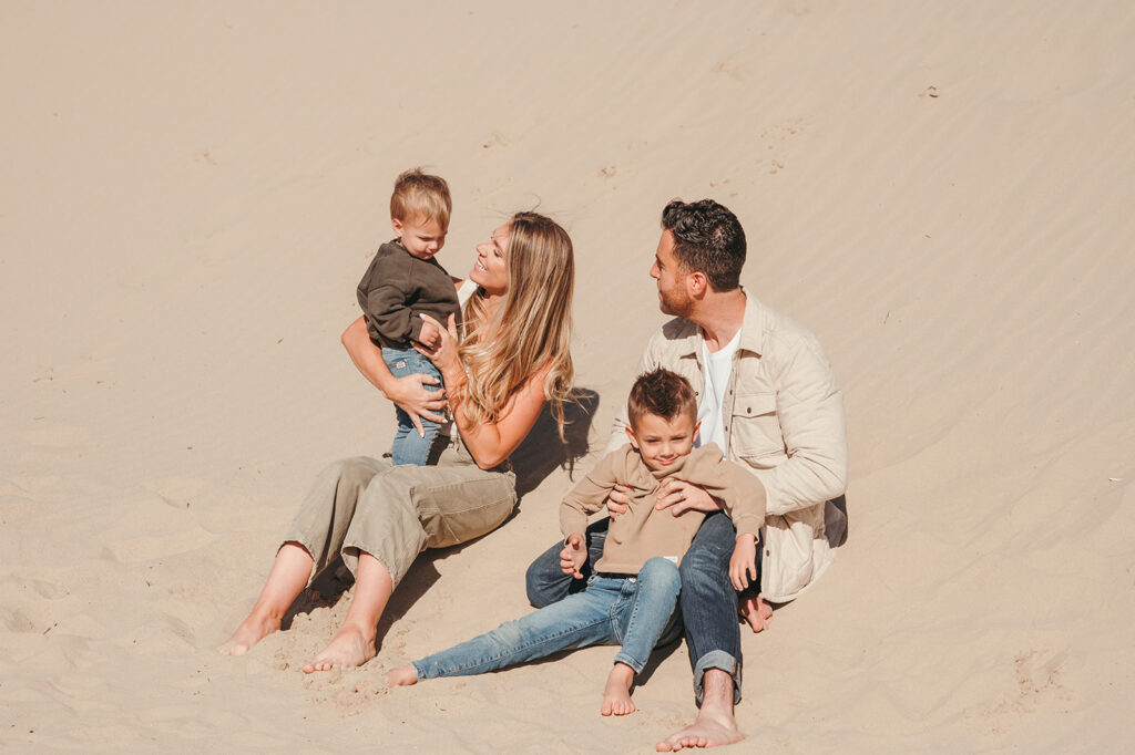 Family sitting at the beach 