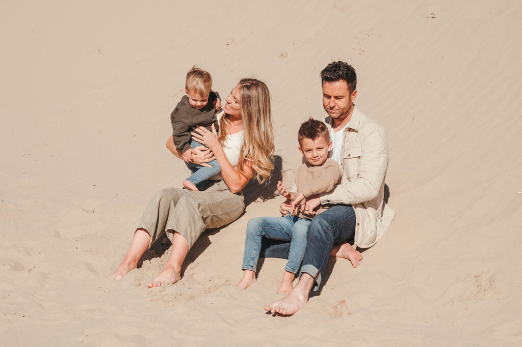 Family sitting at the coast 