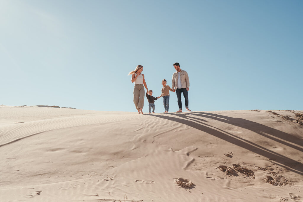 family walking on the dunes 