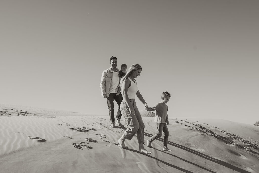 family walking at the beach 