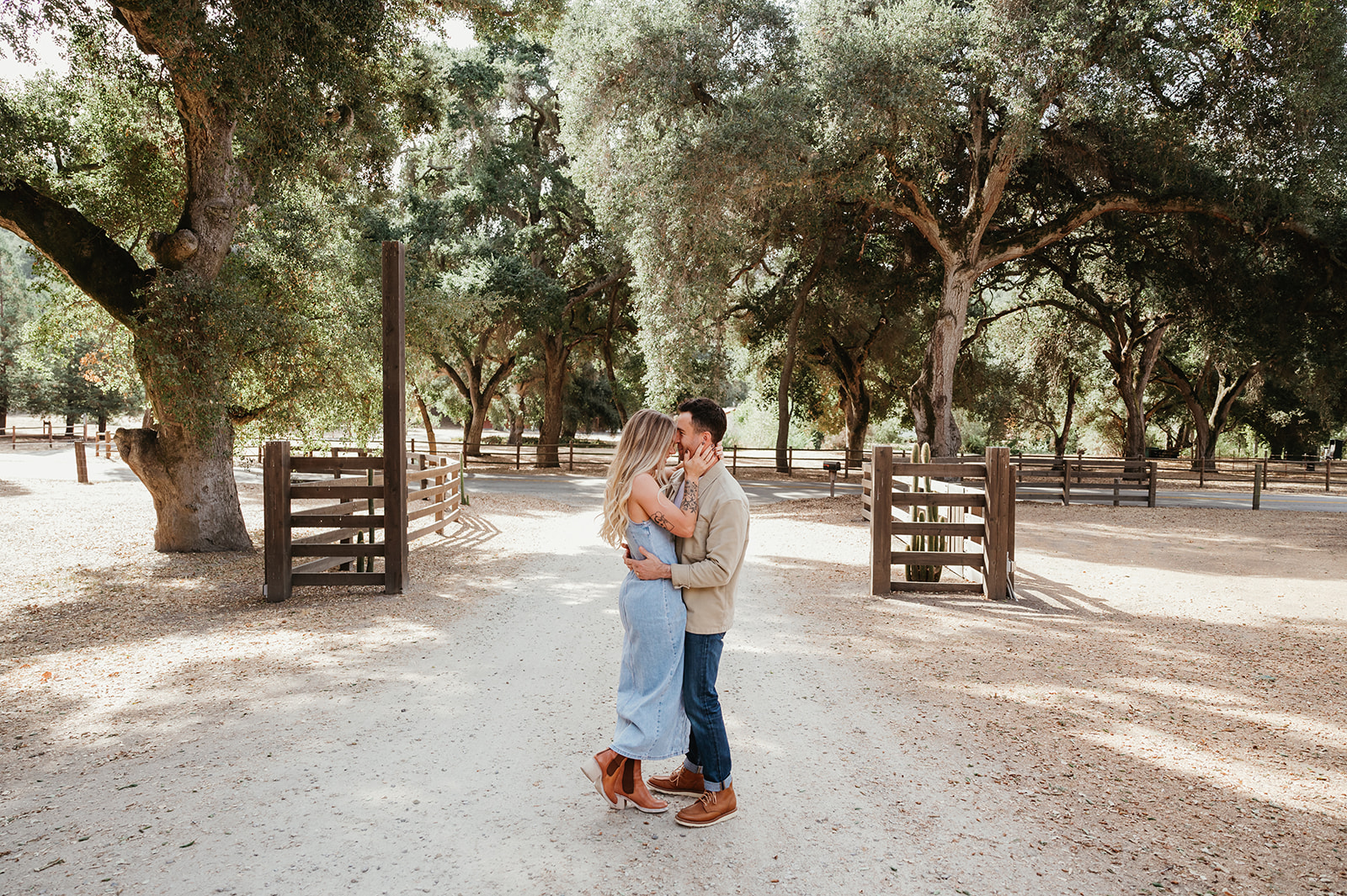 Engaged couple hugging and laughing