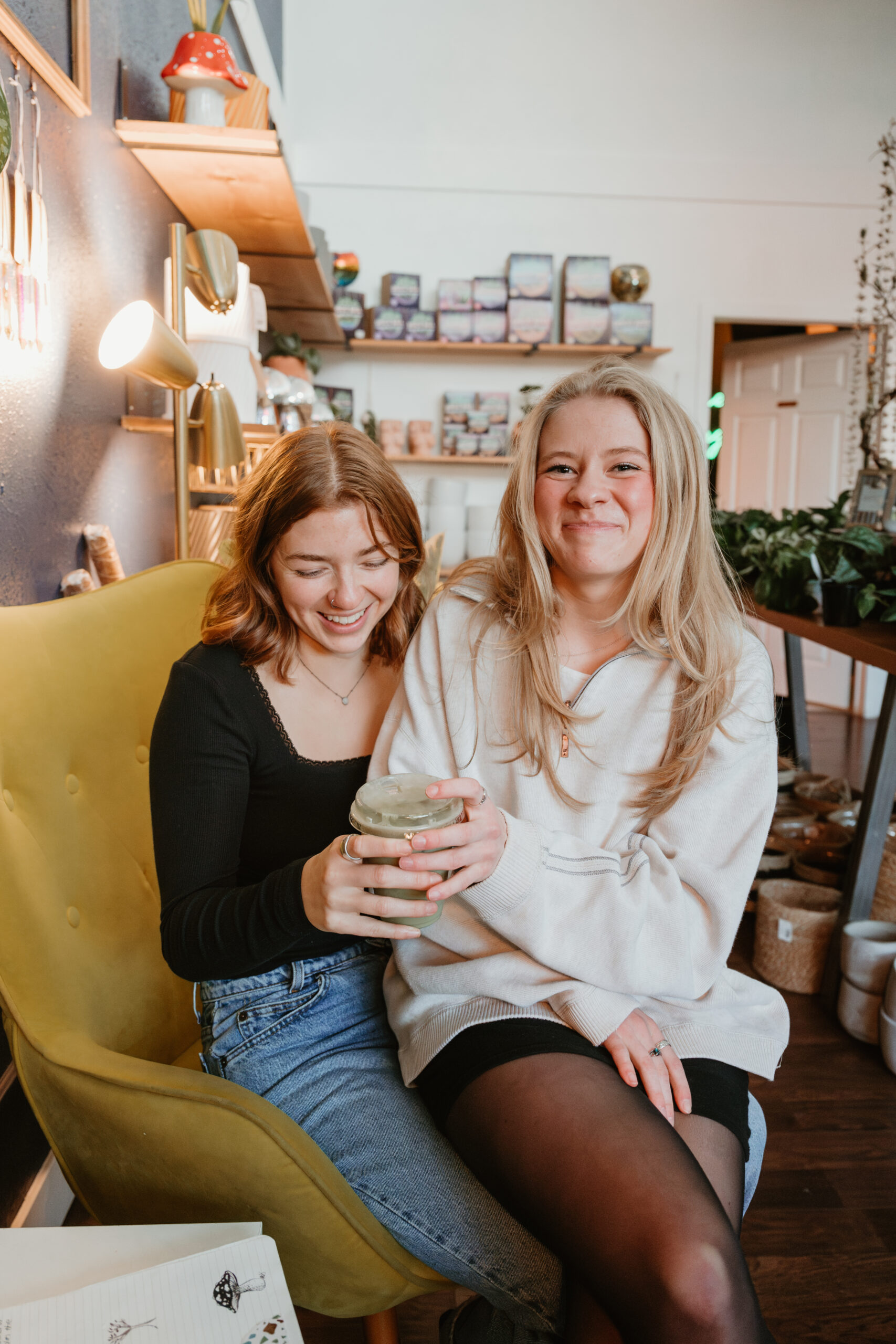 couple drinking coffee and sitting in each others laps 