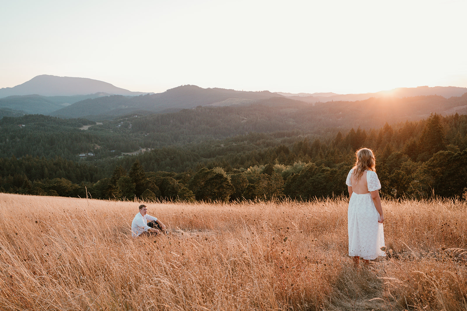 Couple standing apart looking at each other