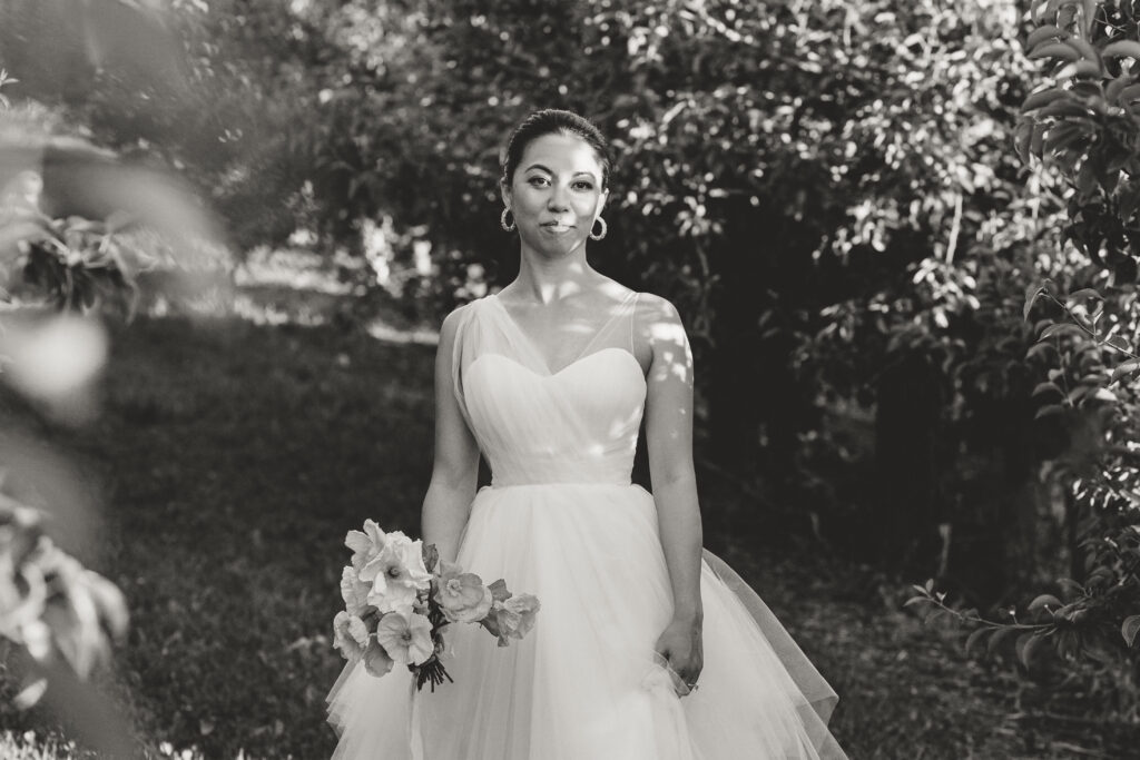 bride in chiffon gown with flowers