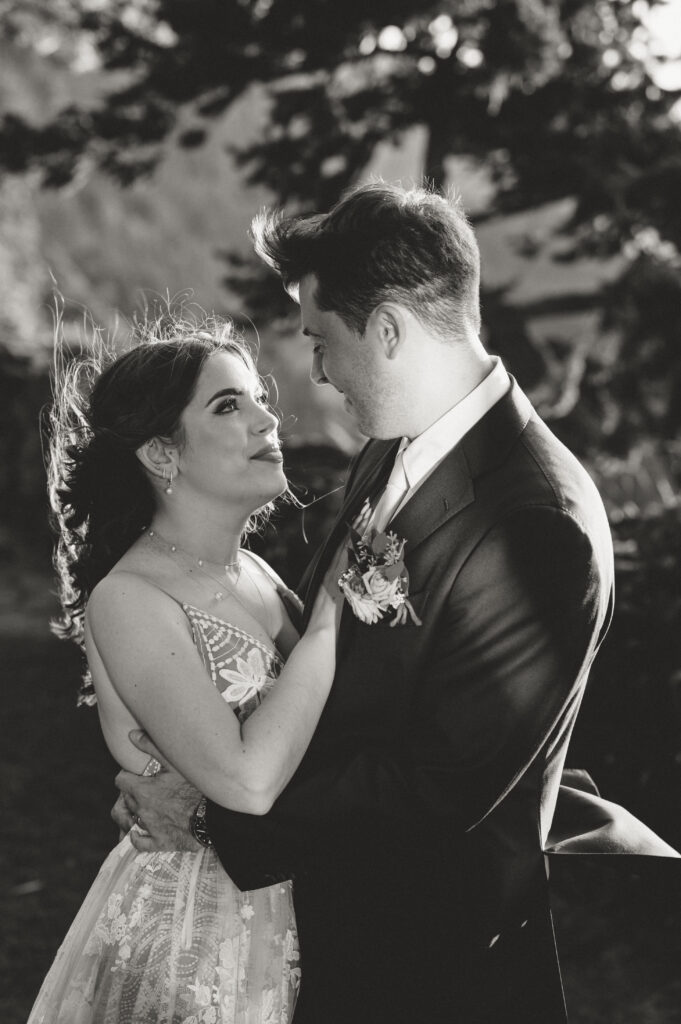 bride and groom looking each other in the eyes in intimate portrait 