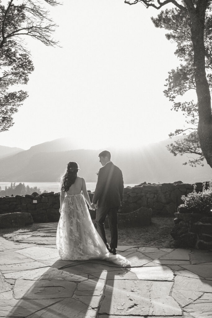 bride and groom at the griffin house facing the view of the Columbia River Gorge 