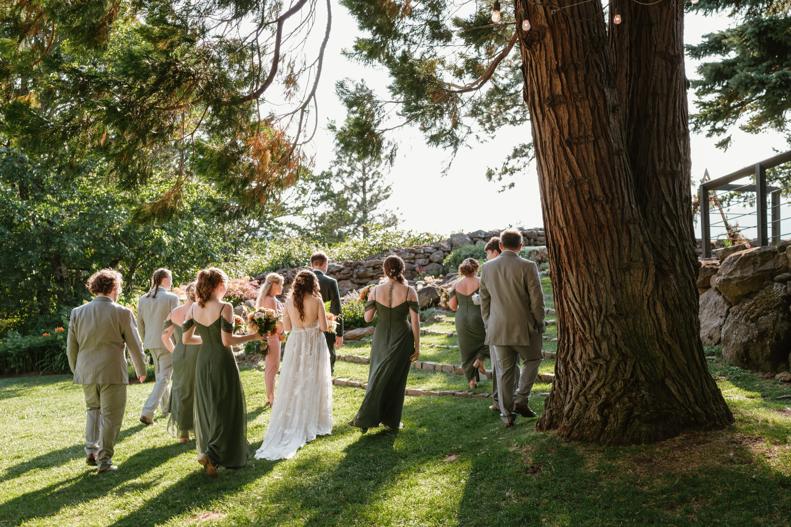 green bridal party dress and grey suits for groomsmen 