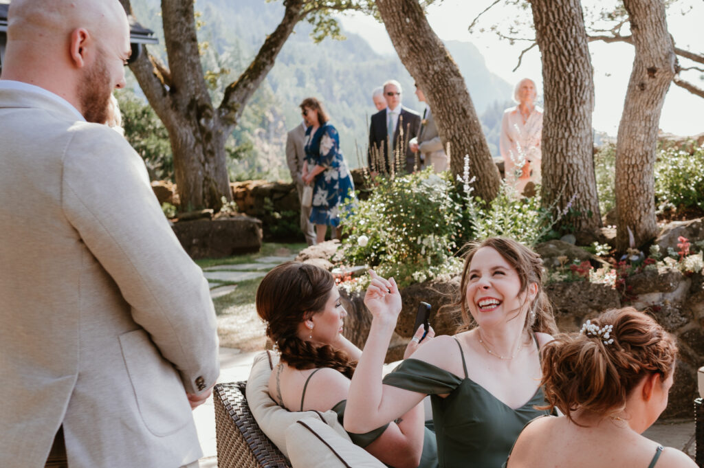 guests at cocktail hour laughing together 