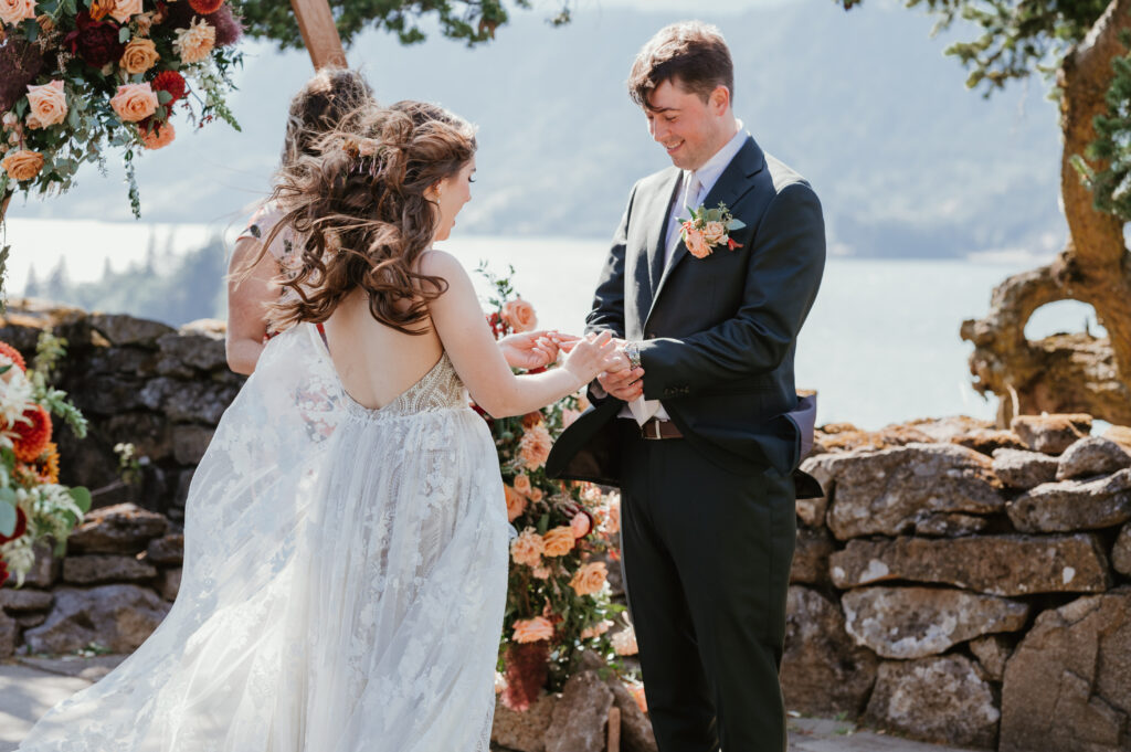 bride and groom exchanging rings during the ceremony 