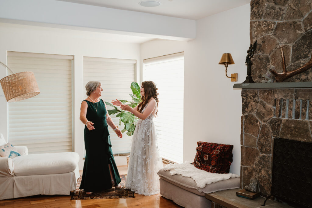 bride and mother of the bride talking before wedding ceremony 