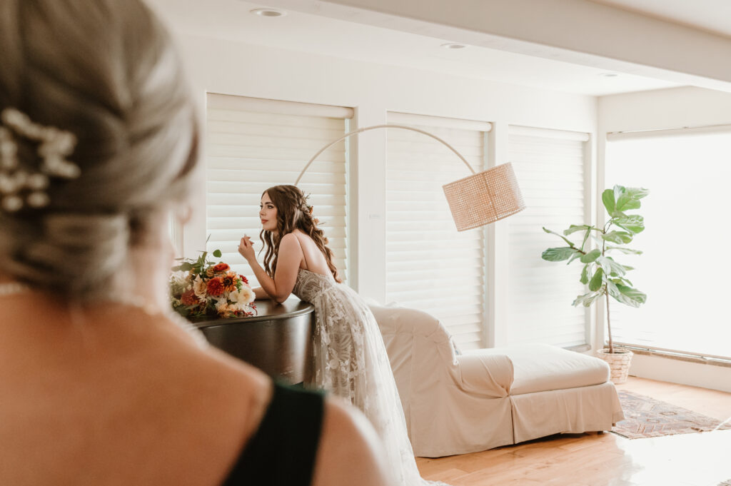 bride and mother of the bride getting ready together 