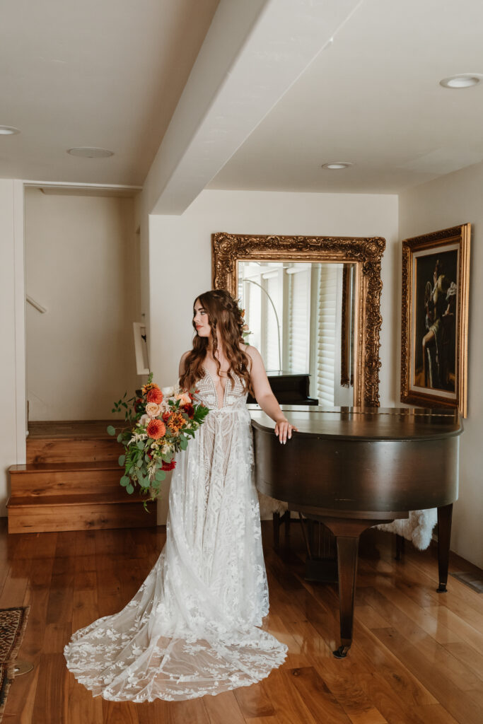 bridal portrait of bride with piano and wedding bouquet 