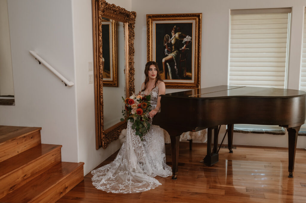 bridal portrait with piano and wedding gown 