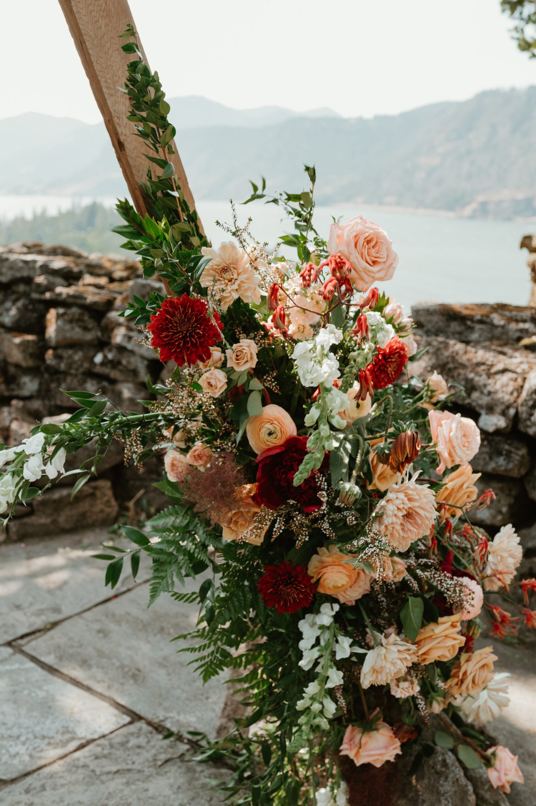 wedding ceremony arch decorated with colorful and bold florals 