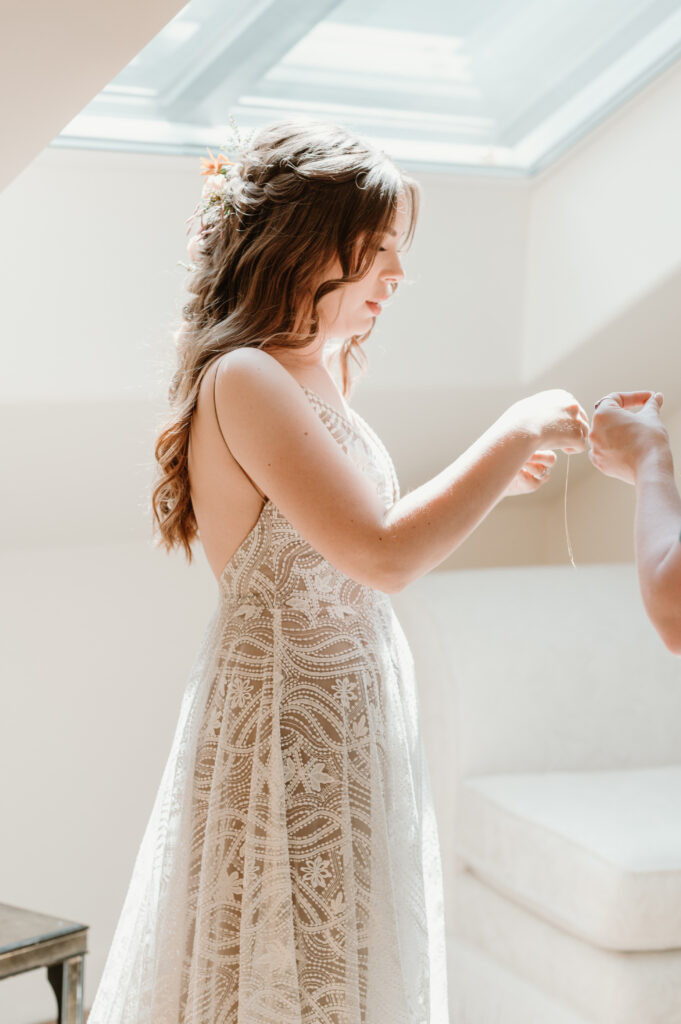 bride and maid of honor getting ready together 