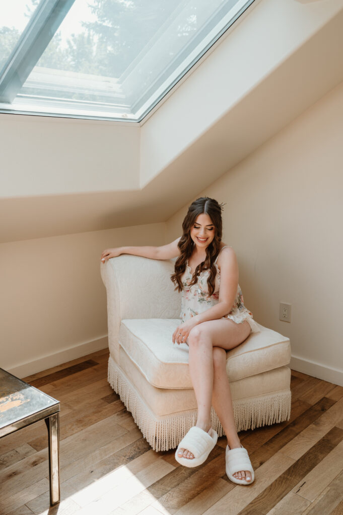 bride in getting ready pajamas on her wedding day