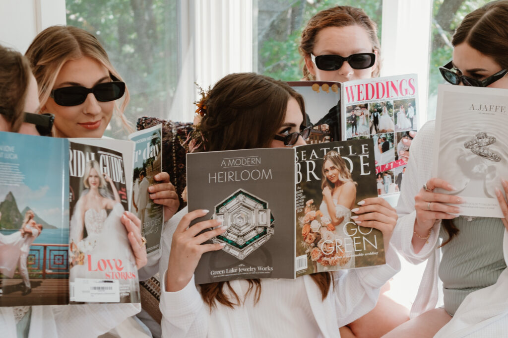 bride holding seattle bride magazine with sunglasses and matching robes 