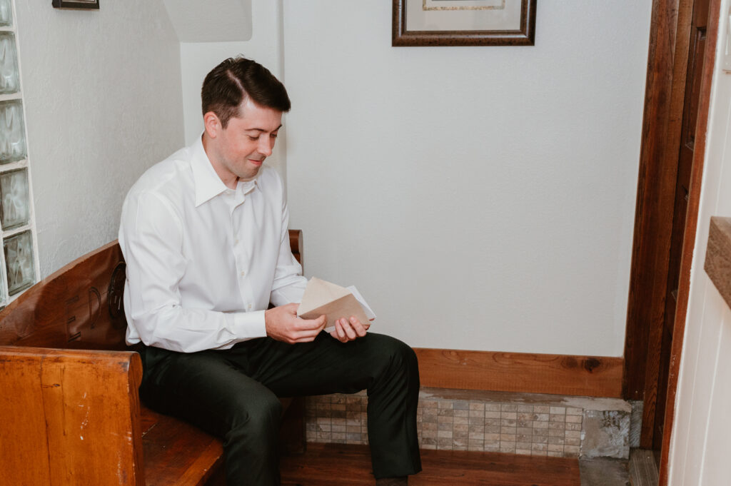 groom reading letter from bride 