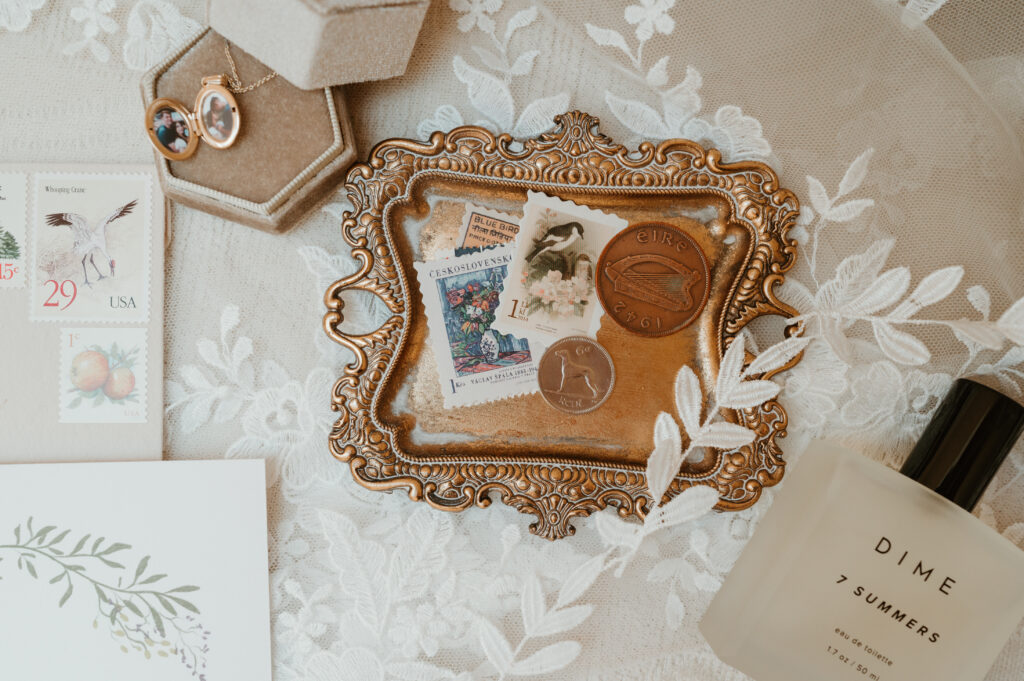 wedding flat lay with coins and stamps 