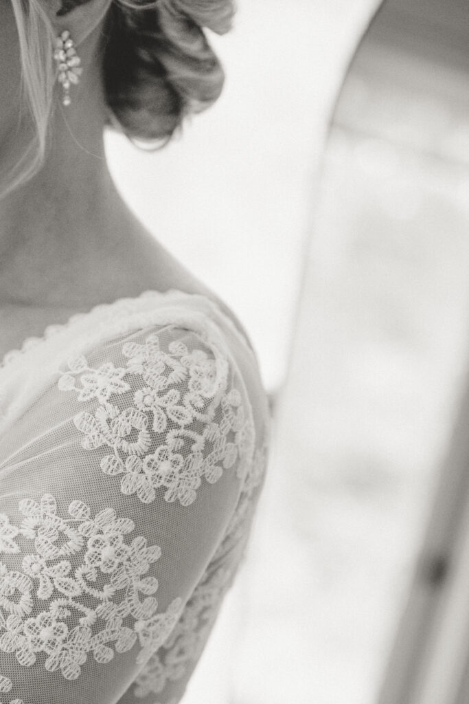 Details of the brides sleeves on her dreamers and lovers lace gown 