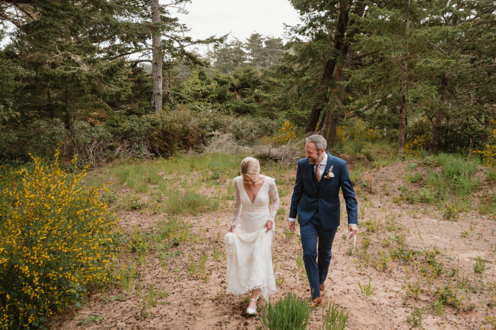 bride and groom walking back to meena lodge together after their private vows and first look 