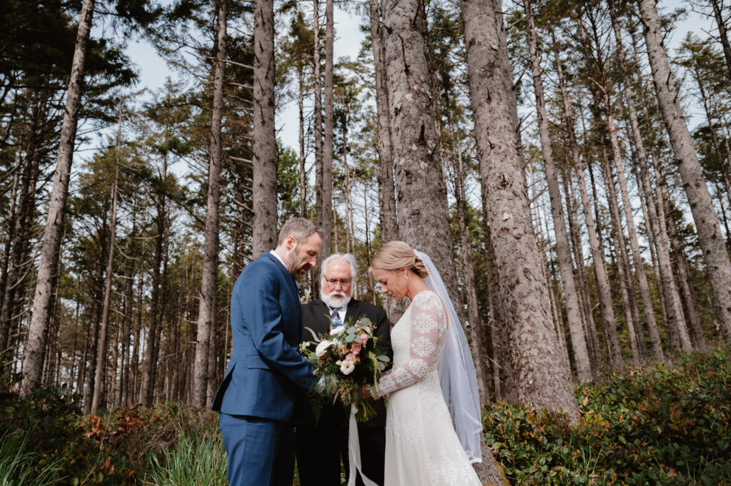 bride and groom praying together during their ceremony 
