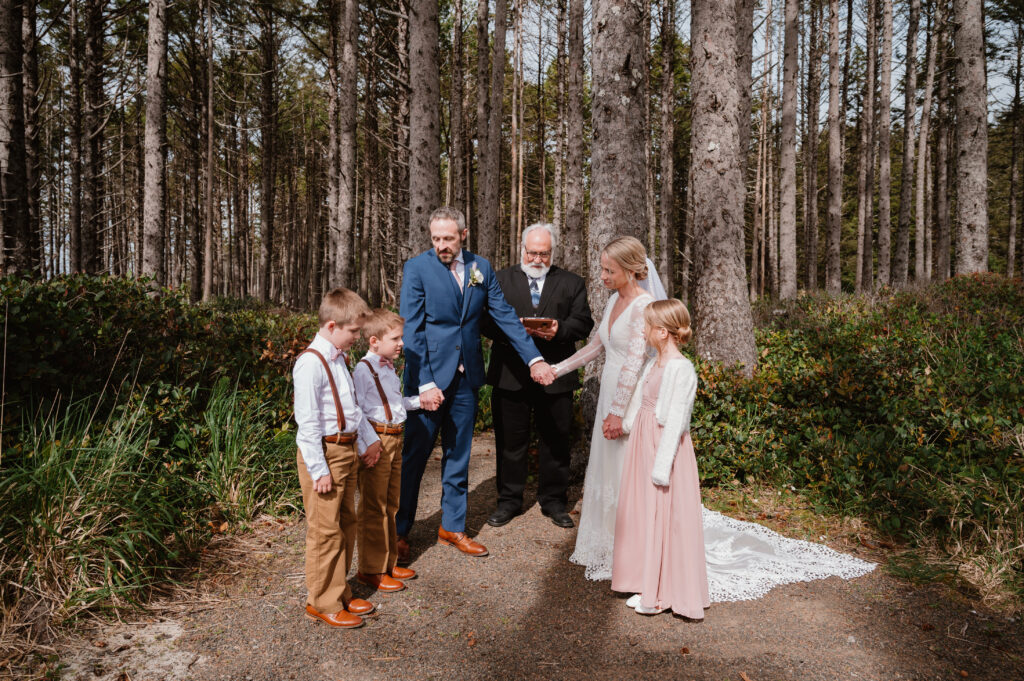 Couple sharing vows with their children during their intimate oregon wedding