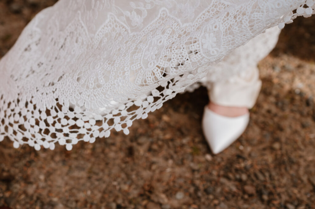 Close up Detail of the brides lace dress from Dreamers and Lovers