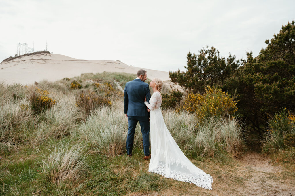Intimate oregon coast wedding setting with couple posed for portraits 
