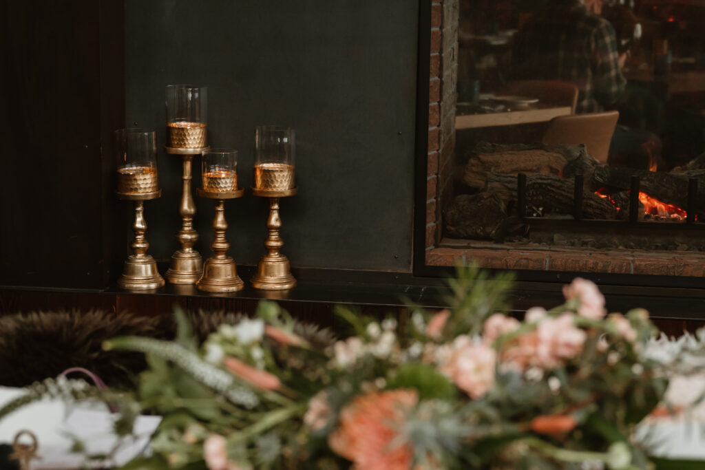 close up details of candles and flowers at an intimate oregon wedding 