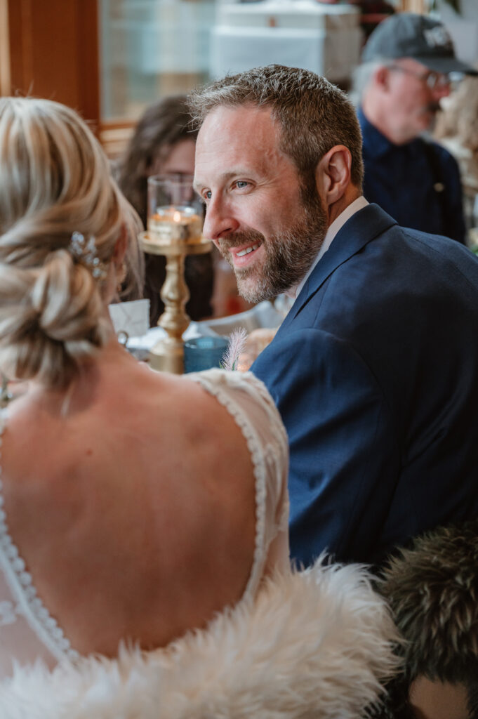 groom looking and smiling at the bride at their intimate oregon coast wedding 